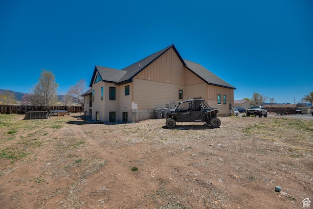 back of house with fence
