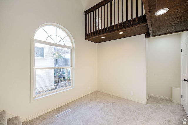916 W 1150 S, Provo, UT 84601 - empty room with visible vents, carpet flooring, baseboards, and stairway