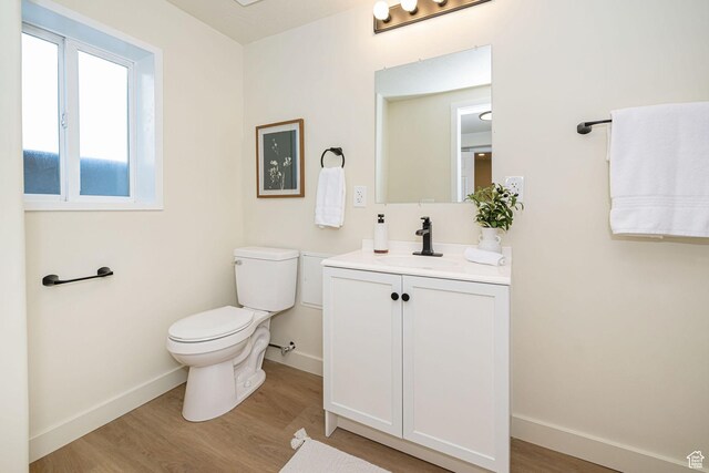 916 W 1150 S, Provo, UT 84601 - bathroom with baseboards, toilet, and wood finished floors