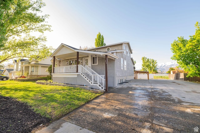 916 W 1150 S, Provo, UT 84601 - view of front of property with covered porch, driveway, stairs, and a front lawn