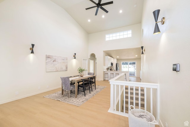 916 W 1150 S, Provo, UT 84601 - dining space with arched walkways, light wood-style flooring, ceiling fan, and high vaulted ceiling