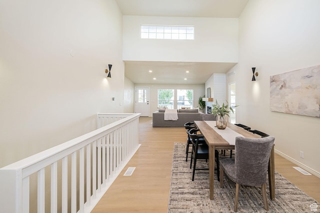 916 W 1150 S, Provo, UT 84601 - dining room featuring visible vents, light wood-style floors, and a high ceiling