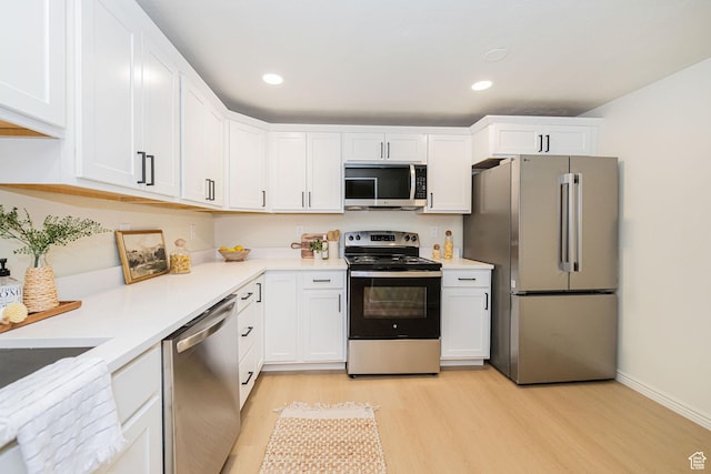 916 W 1150 S, Provo, UT 84601 - kitchen featuring light countertops, white cabinets, stainless steel appliances, and light wood-type flooring