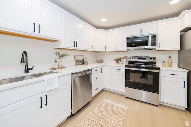 916 W 1150 S, Provo, UT 84601 - kitchen featuring a sink, appliances with stainless steel finishes, white cabinets, and light countertops