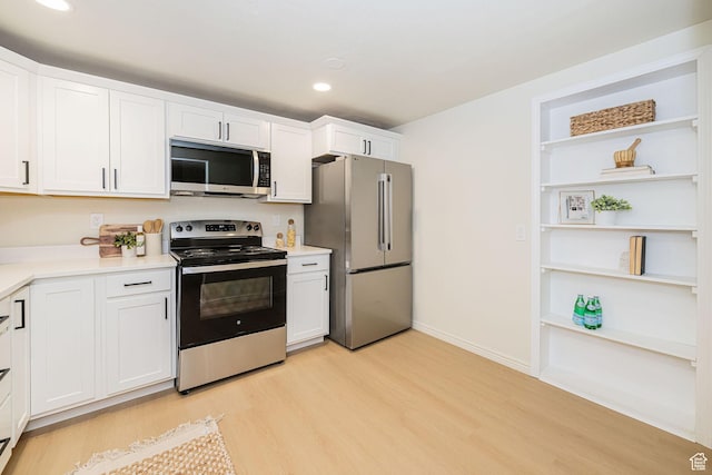 916 W 1150 S, Provo, UT 84601 - kitchen with recessed lighting, light countertops, white cabinetry, light wood-style flooring, and stainless steel appliances