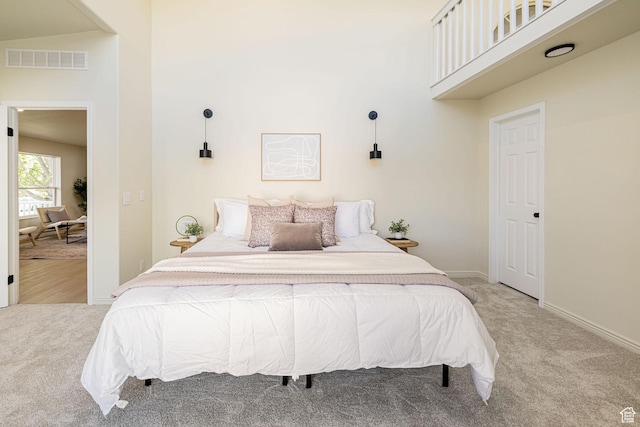 916 W 1150 S, Provo, UT 84601 - bedroom with baseboards, visible vents, light carpet, and a towering ceiling