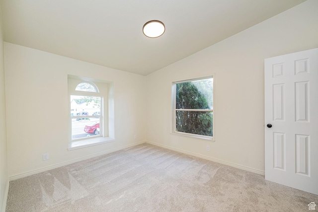 916 W 1150 S, Provo, UT 84601 - spare room featuring baseboards, vaulted ceiling, and light colored carpet