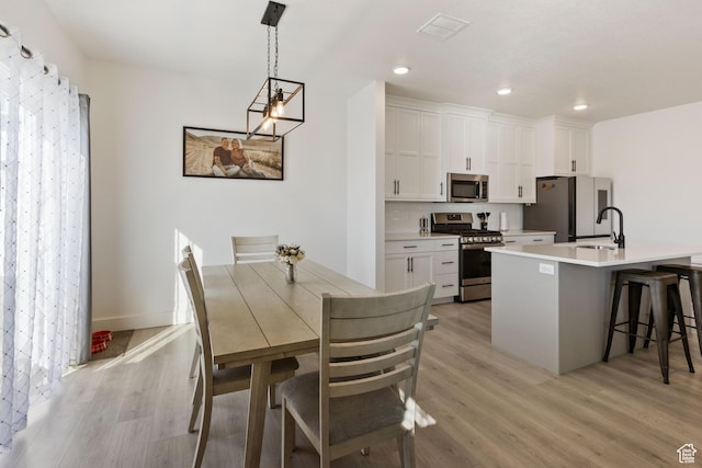 889 N 900 W, Tremonton, UT 84337 - dining room featuring recessed lighting and light wood-type flooring