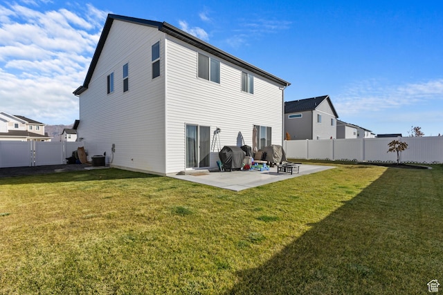 889 N 900 W, Tremonton, UT 84337 - back of property with a yard, a patio, central AC unit, and a fenced backyard
