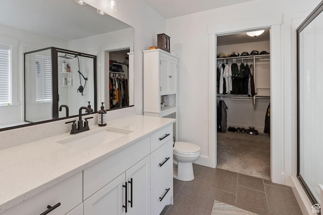 889 N 900 W, Tremonton, UT 84337 - full bath featuring vanity, a stall shower, toilet, and a walk in closet