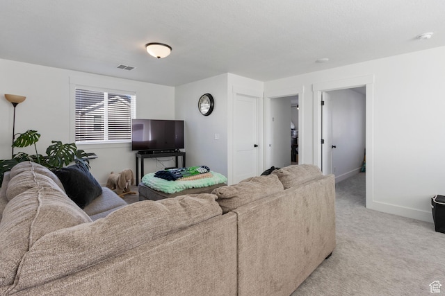 889 N 900 W, Tremonton, UT 84337 - living area with visible vents, baseboards, and light colored carpet