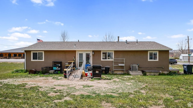 84 N 100 W, Sterling, UT 84665 - back of house featuring roof with shingles, stucco siding, cooling unit, french doors, and a yard