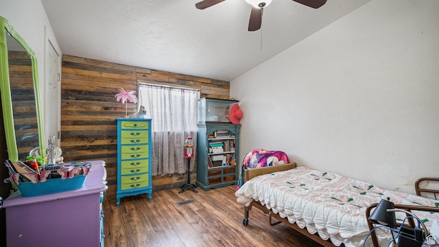 84 N 100 W, Sterling, UT 84665 - bedroom with ceiling fan, wood walls, and wood finished floors