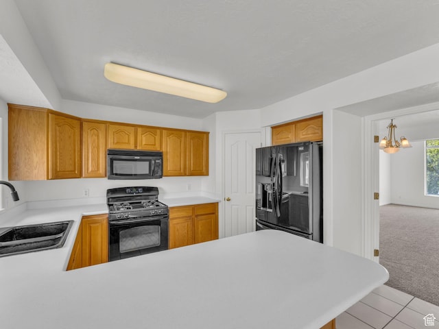 1788 W Nobility Cir, Salt Lake City, UT 84116 - kitchen with a peninsula, black appliances, light countertops, a sink, and a notable chandelier
