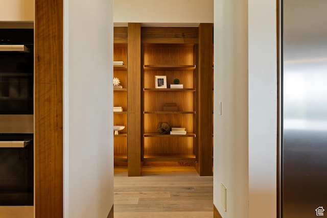 772 S Summit Creek Dr, Woodland Hills, UT 84653 - corridor featuring wood finished floors and built in features