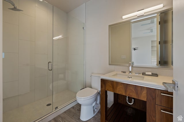 772 S Summit Creek Dr, Woodland Hills, UT 84653 - bathroom featuring a shower stall, toilet, wood finished floors, and vanity