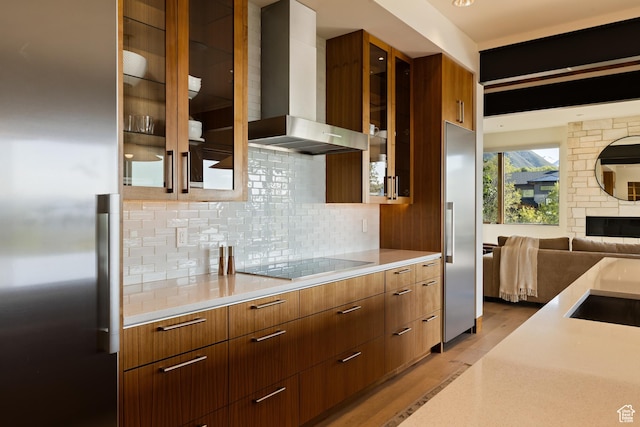 772 S Summit Creek Dr, Woodland Hills, UT 84653 - kitchen featuring wall chimney exhaust hood, black electric cooktop, modern cabinets, and light countertops