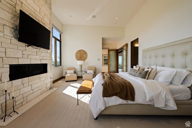 772 S Summit Creek Dr, Woodland Hills, UT 84653 - bedroom with carpet floors and a stone fireplace