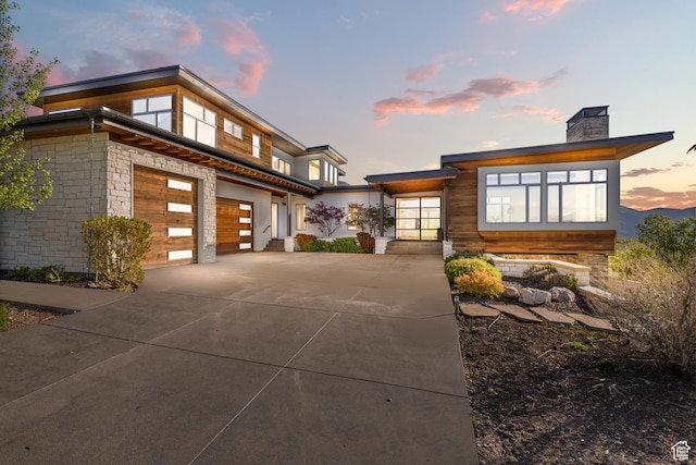 772 S Summit Creek Dr, Woodland Hills, UT 84653 - view of front of property with driveway, a chimney, and a garage