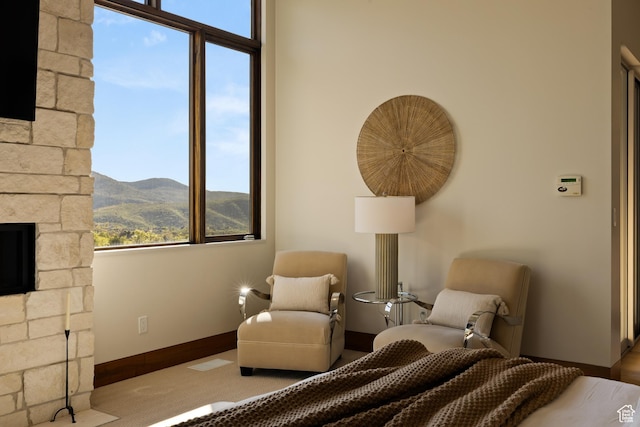 772 S Summit Creek Dr, Woodland Hills, UT 84653 - bedroom featuring a fireplace, a mountain view, and baseboards
