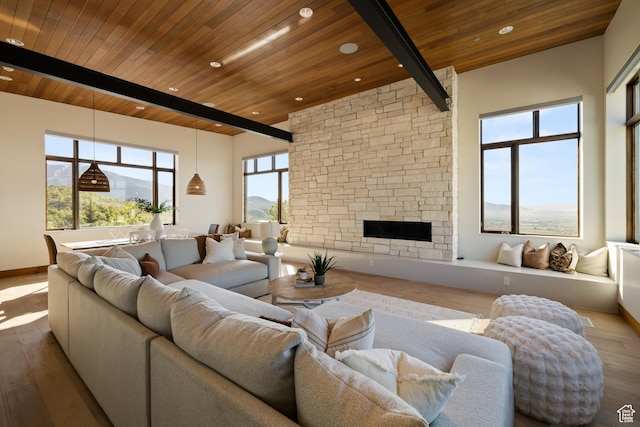 772 S Summit Creek Dr, Woodland Hills, UT 84653 - living room featuring wood ceiling, wood finished floors, beam ceiling, a stone fireplace, and recessed lighting