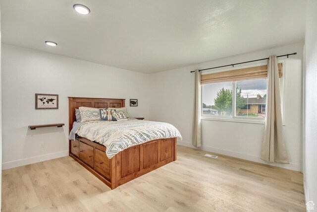 584 E Aspen Way, Centerville, UT 84014 - bedroom with baseboards, visible vents, and light wood-style flooring