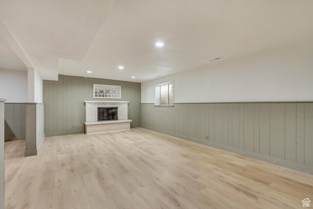 584 E Aspen Way, Centerville, UT 84014 - below grade area with recessed lighting, wainscoting, light wood finished floors, and a premium fireplace