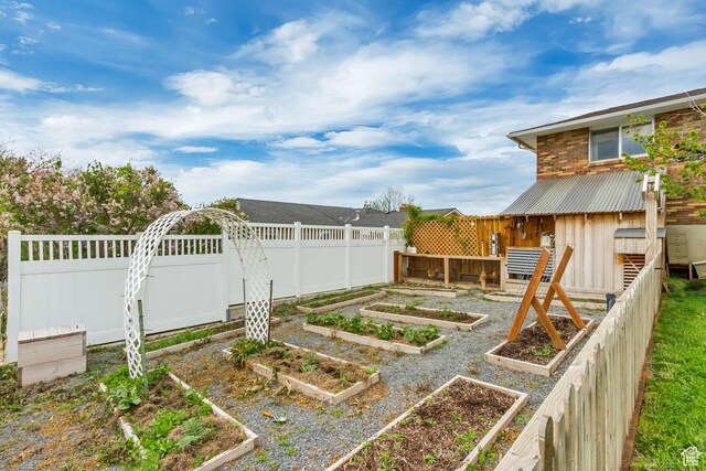 584 E Aspen Way, Centerville, UT 84014 - view of yard featuring a fenced backyard and a vegetable garden