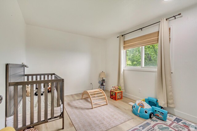 584 E Aspen Way, Centerville, UT 84014 - bedroom with baseboards and wood finished floors