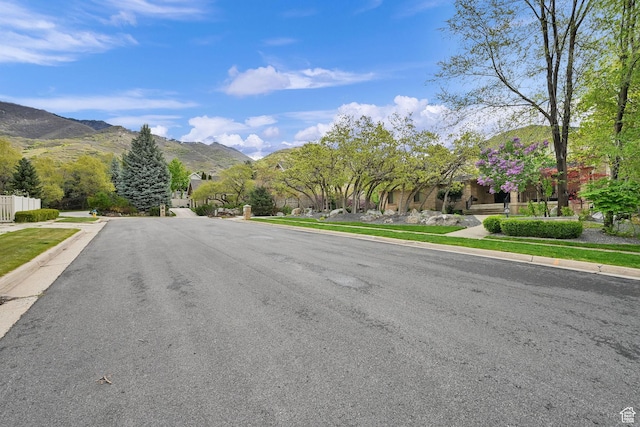 5078 S Iroquois Way E, Ogden, UT 84403 - view of street featuring sidewalks, a mountain view, and curbs