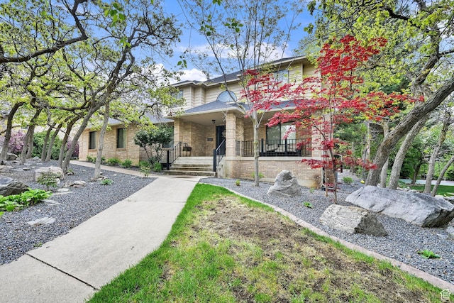 5078 S Iroquois Way E, Ogden, UT 84403 - traditional home with a porch and brick siding