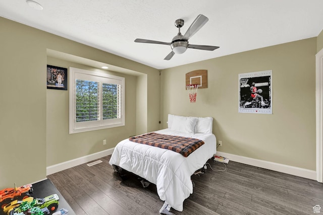 5078 S Iroquois Way E, Ogden, UT 84403 - bedroom featuring baseboards, visible vents, dark wood-style floors, and ceiling fan