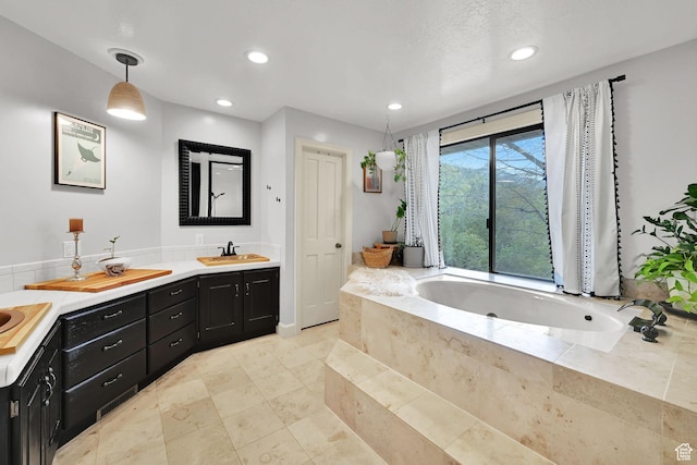 5078 S Iroquois Way E, Ogden, UT 84403 - full bath with a sink, double vanity, recessed lighting, and a bath