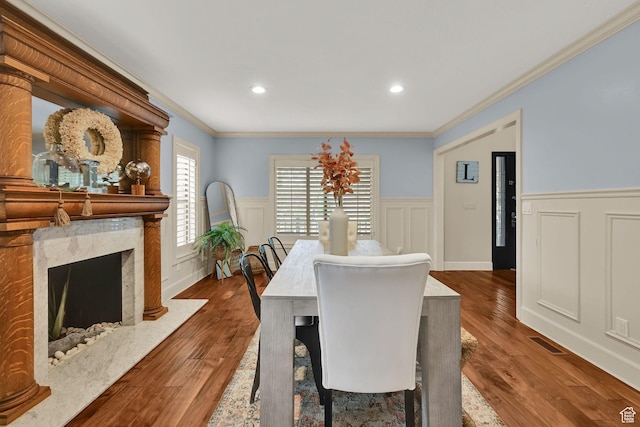 5078 S Iroquois Way E, Ogden, UT 84403 - dining room featuring visible vents, ornamental molding, a wainscoted wall, and wood finished floors