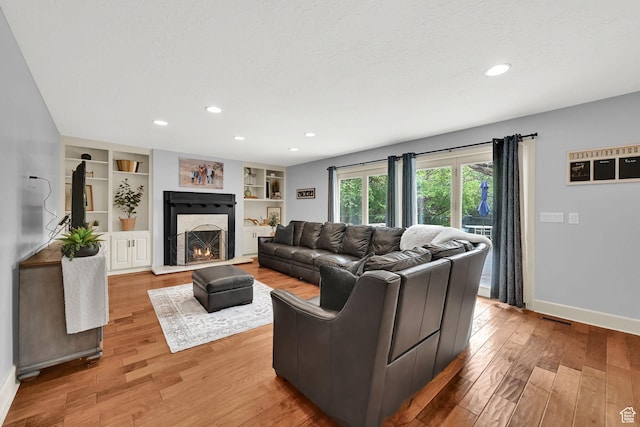 5078 S Iroquois Way E, Ogden, UT 84403 - living area with recessed lighting, baseboards, and light wood-style flooring