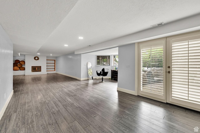 5078 S Iroquois Way E, Ogden, UT 84403 - unfurnished living room with baseboards, recessed lighting, a textured ceiling, and hardwood / wood-style floors