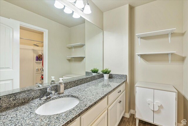 204 E 460 N, Vineyard, UT 84059 - bathroom with vanity, baseboards, and wood finished floors