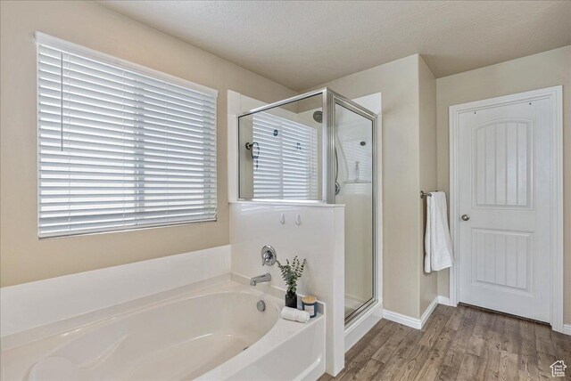 204 E 460 N, Vineyard, UT 84059 - full bathroom with a textured ceiling, a bath, a stall shower, wood finished floors, and baseboards