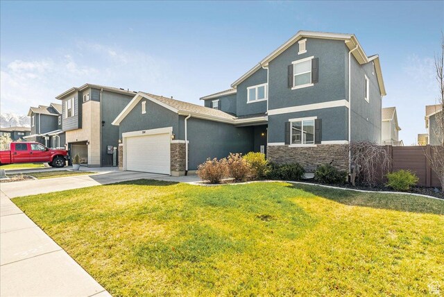 204 E 460 N, Vineyard, UT 84059 - craftsman-style house featuring an attached garage, stucco siding, stone siding, and concrete driveway