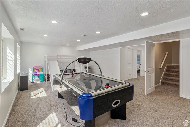 204 E 460 N, Vineyard, UT 84059 - rec room with a textured ceiling, baseboards, light colored carpet, and visible vents