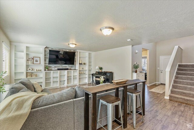 204 E 460 N, Vineyard, UT 84059 - living area featuring stairs, baseboards, a textured ceiling, and wood finished floors