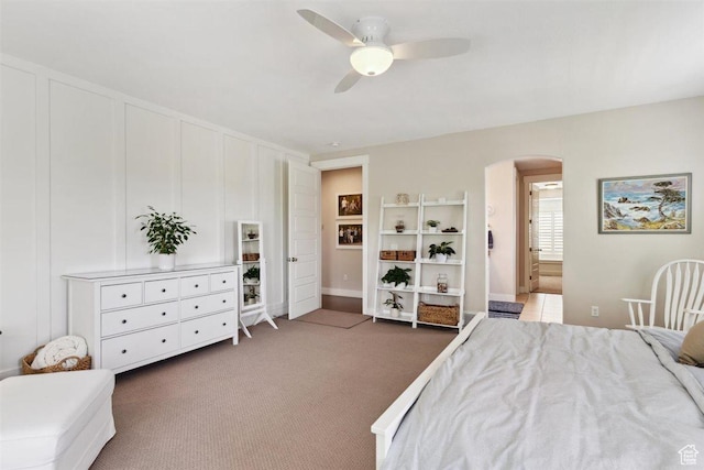 1485 E Peachtree Ln, Fruit Heights, UT 84037 - bedroom featuring arched walkways, a ceiling fan, carpet flooring, and connected bathroom