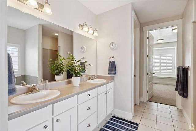 1485 E Peachtree Ln, Fruit Heights, UT 84037 - bathroom featuring a sink, baseboards, tile patterned flooring, and double vanity