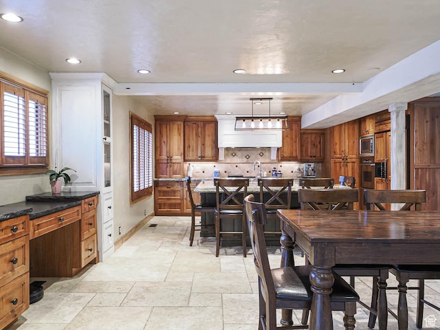 418 E Bridlewalk Ln, Murray, UT 84107 - dining space with baseboards, recessed lighting, decorative columns, and stone tile floors