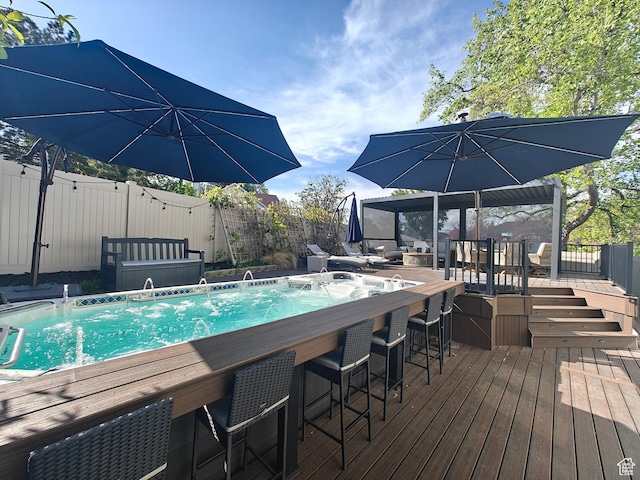 418 E Bridlewalk Ln, Murray, UT 84107 - view of swimming pool featuring a wooden deck, a fenced backyard, and outdoor dry bar