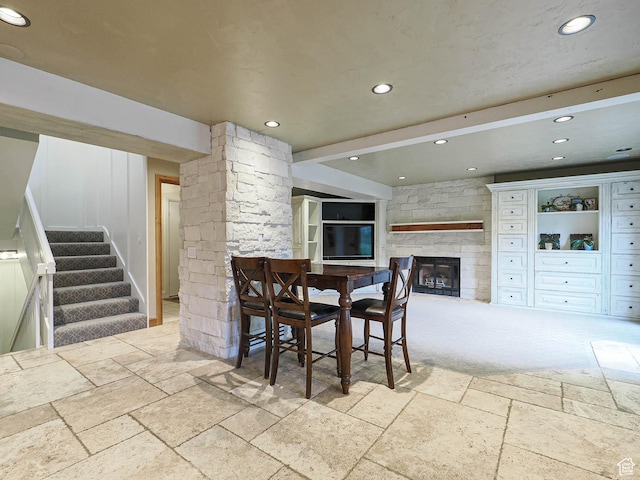 418 E Bridlewalk Ln, Murray, UT 84107 - dining space with a fireplace, recessed lighting, stairs, and stone tile flooring