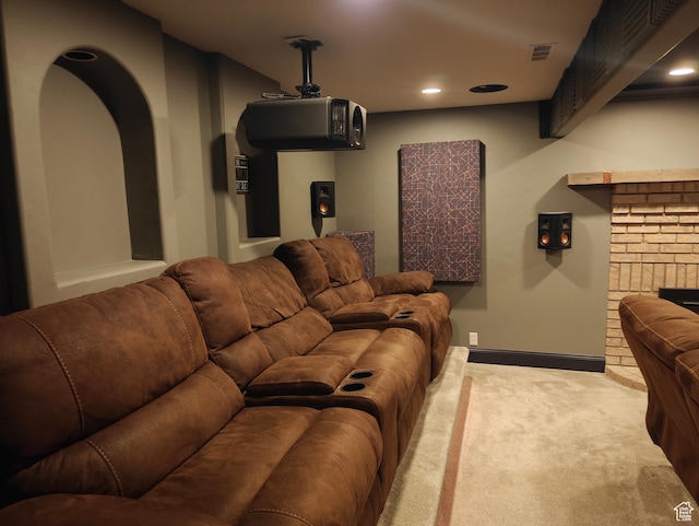418 E Bridlewalk Ln, Murray, UT 84107 - carpeted home theater room featuring arched walkways, a fireplace, recessed lighting, and visible vents