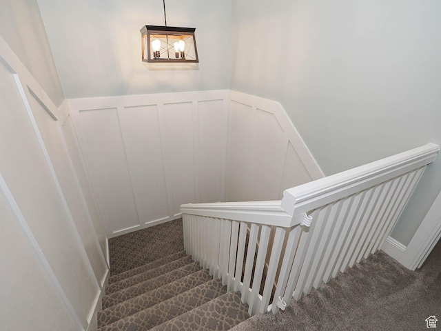 418 E Bridlewalk Ln, Murray, UT 84107 - stairs with carpet flooring, a decorative wall, and a wainscoted wall