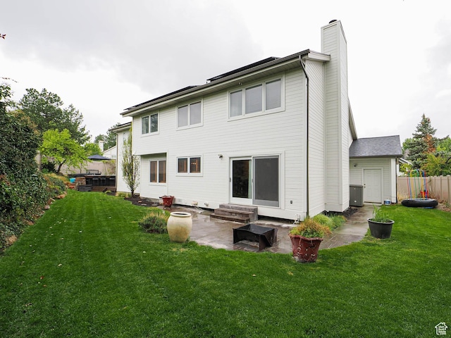 418 E Bridlewalk Ln, Murray, UT 84107 - back of house featuring a chimney, a patio area, fence, a yard, and entry steps