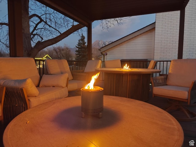 418 E Bridlewalk Ln, Murray, UT 84107 - view of patio featuring an outdoor living space with a fire pit and a mountain view